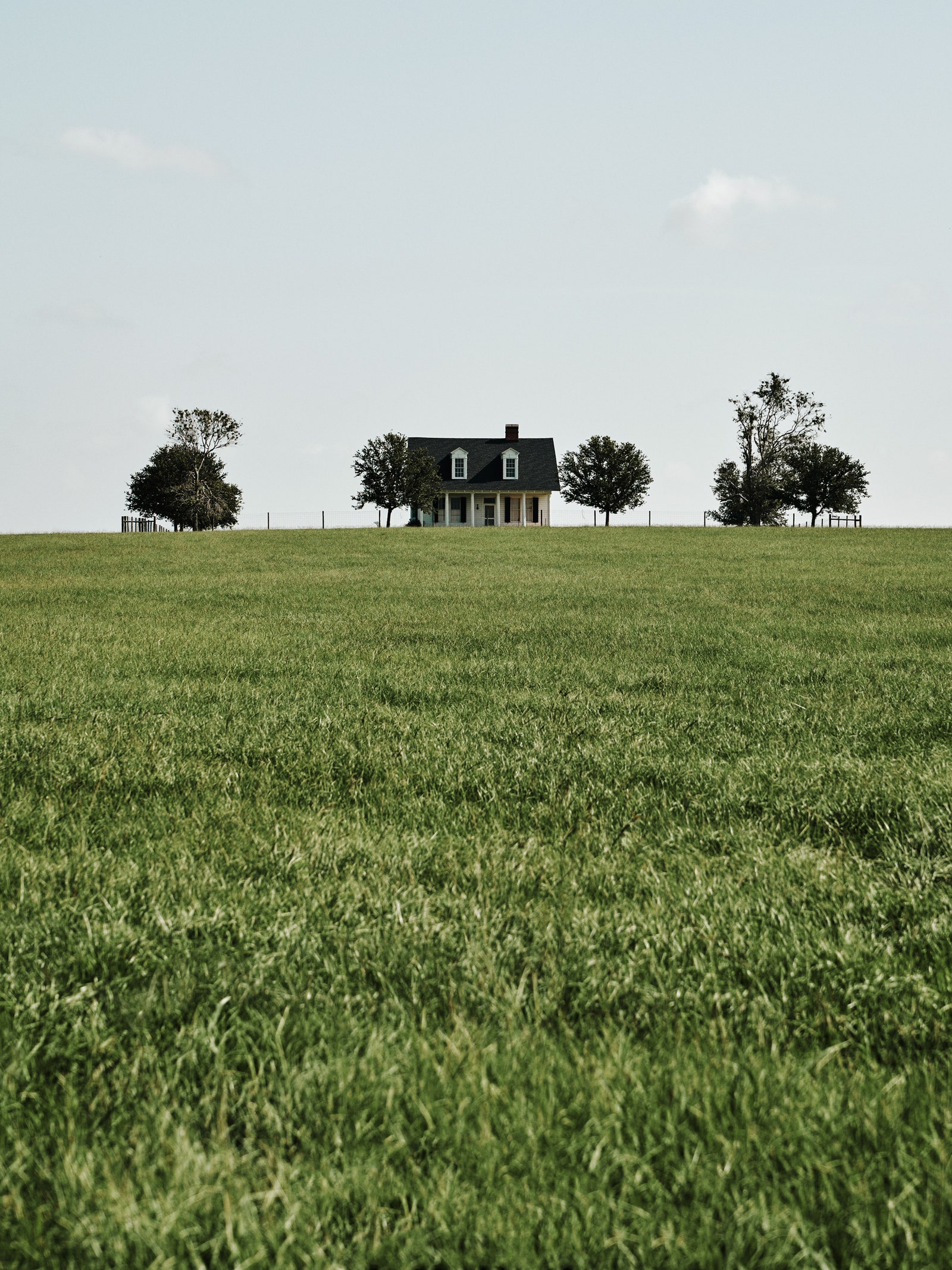 A white house sits atop the Vinton Dome overlooking Gray Ranch.