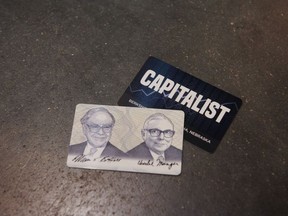 Capitalist cards offered during a shareholders shopping day ahead of the Berkshire Hathaway annual meeting in Omaha, Nebraska, U.S., on Friday, April 29, 2022. After hanging in the shadows for most of the pandemic, Warren Buffet and his deputies have been ramping up Berkshire Hathaway Inc.s acquisition machine -- snapping up shares of Occidental Petroleum Corp. and HP Inc. and striking an $11.6 billion deal to buy Alleghany Corp.